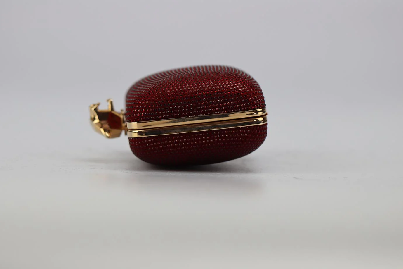 STARK CRYSTAL EMBELLISHED SUEDE AND ROSE GOLD TONE CLUTCH - Image 4