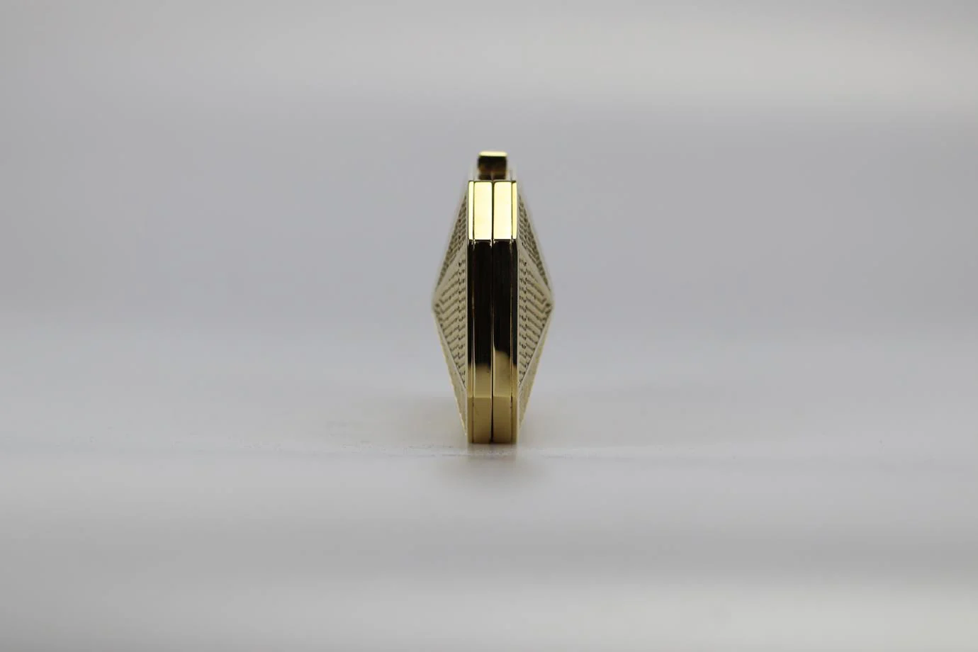 STARK EMBOSSED GOLD TONE CLUTCH - Image 3